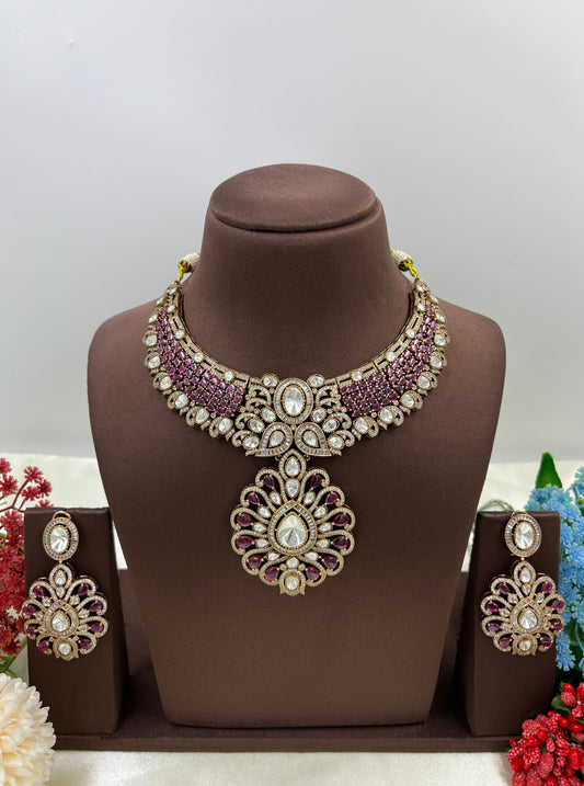 Ornate necklace set on a brown mannequin with flowers in the background