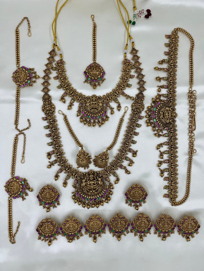 Set of gold jewelry pieces on a white background
